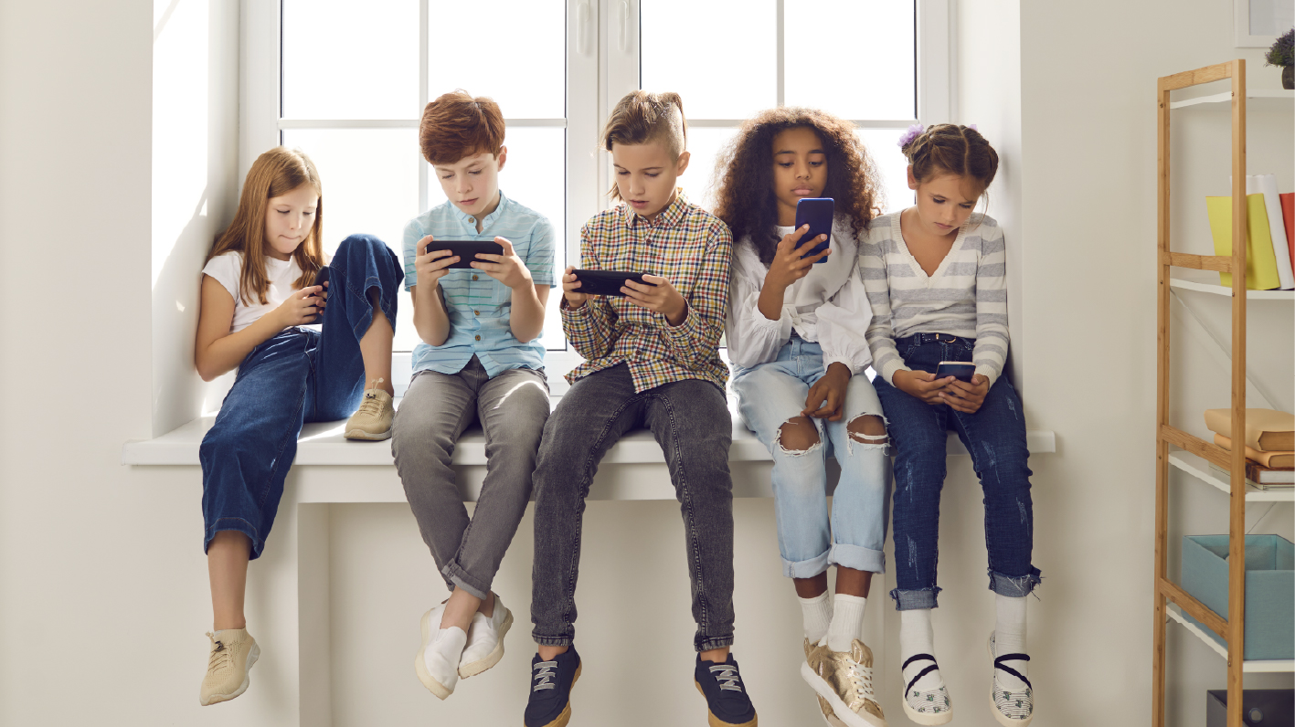 Kids looking at cellphones