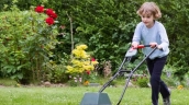 Child pushing lawnmower
