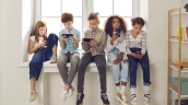 Kids looking at cellphones