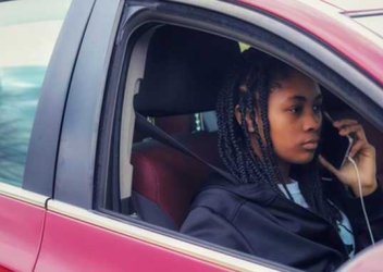 Youth on phone in car