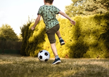 child playing soccer