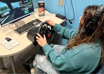 teen taking virtual driving assessment