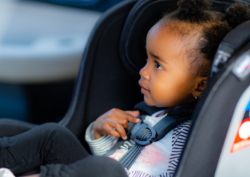 young girl in rear-facing car seat