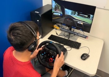 boy taking virtual driving assessment