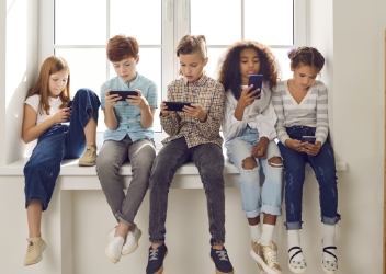 Kids looking at cellphones